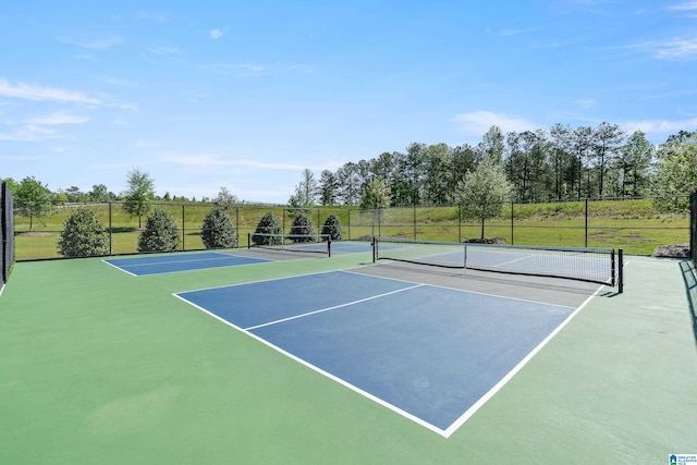 view of tennis court featuring basketball court