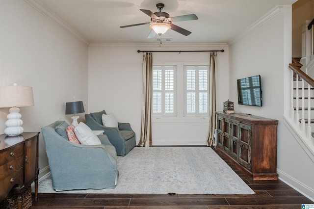 living room featuring ceiling fan and ornamental molding