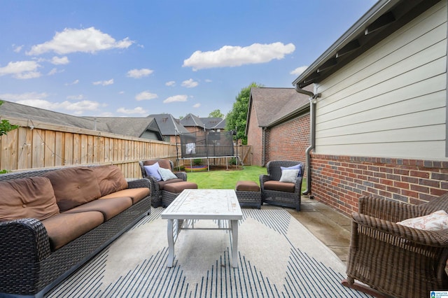 view of patio / terrace with an outdoor living space and a trampoline