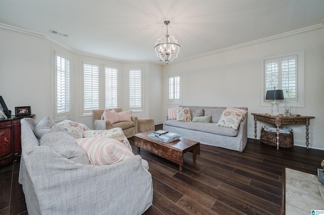 living room with an inviting chandelier and ornamental molding