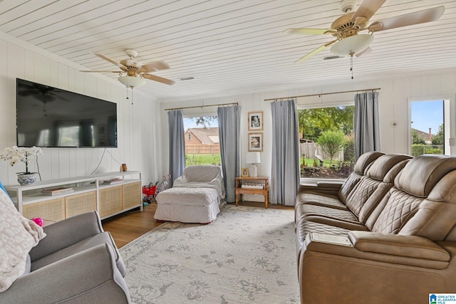 living room with hardwood / wood-style flooring, wood ceiling, and ceiling fan