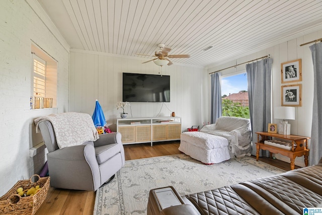 living room with ceiling fan, wood-type flooring, and wooden ceiling