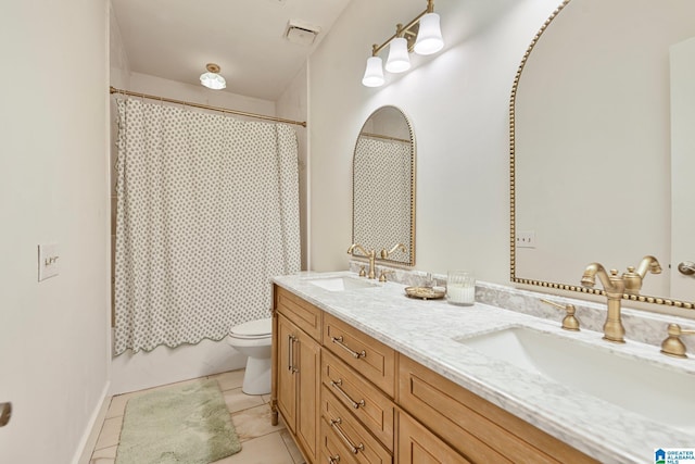 full bathroom with vanity, toilet, tile patterned flooring, and shower / bath combo with shower curtain