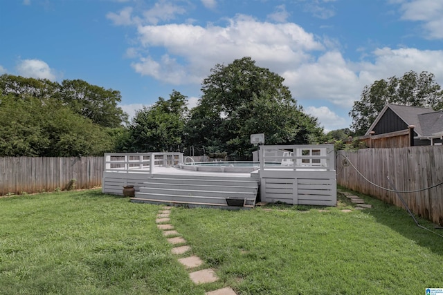 view of yard with a swimming pool side deck