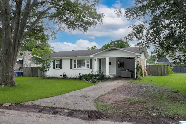 ranch-style home featuring a front yard