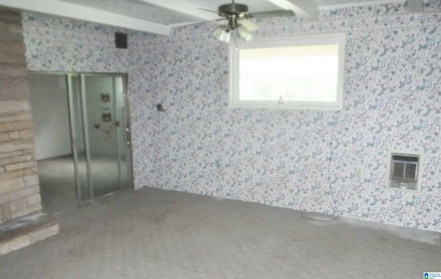 empty room featuring carpet floors and ceiling fan