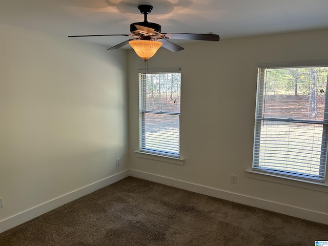 spare room featuring carpet floors and ceiling fan