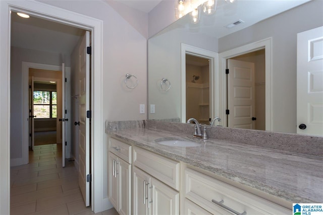 bathroom with vanity and tile patterned flooring