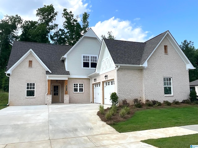 view of front facade with a garage and a front yard