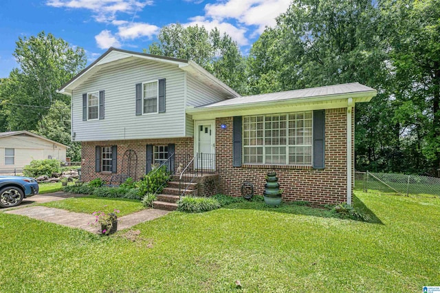 tri-level home featuring a front lawn