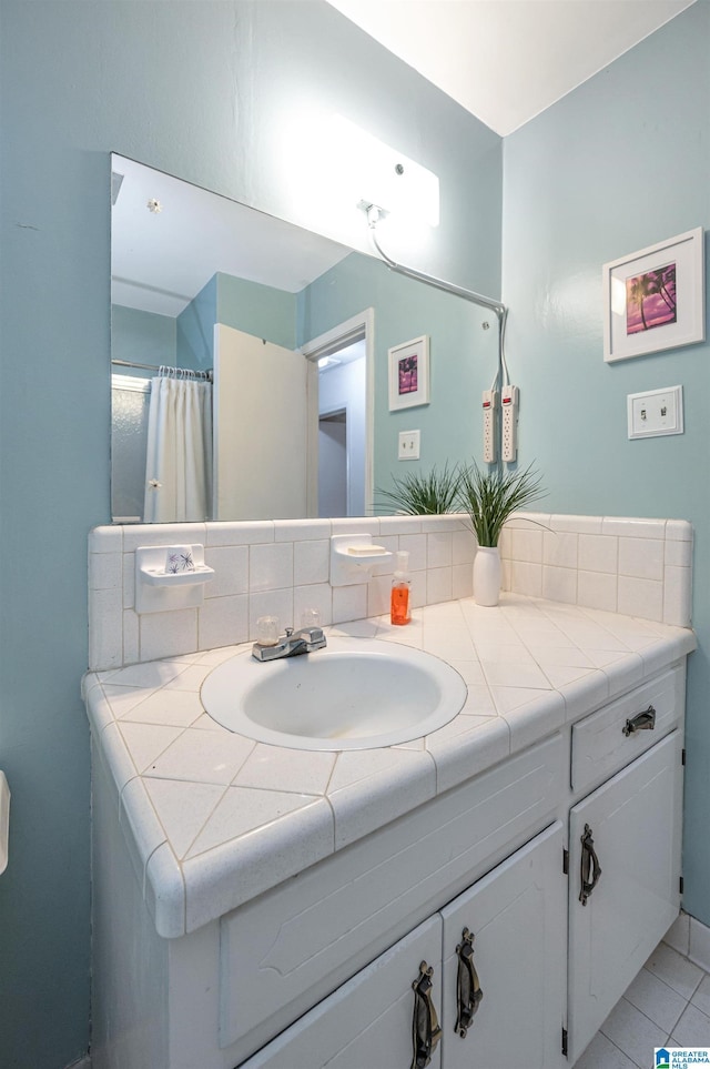 bathroom with vanity and tile patterned flooring