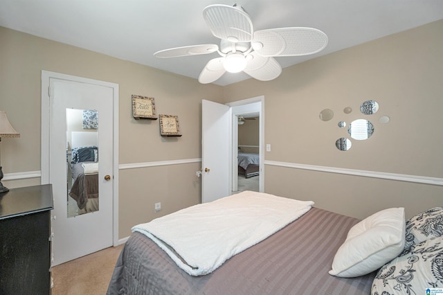 bedroom with light carpet, ceiling fan, and a closet