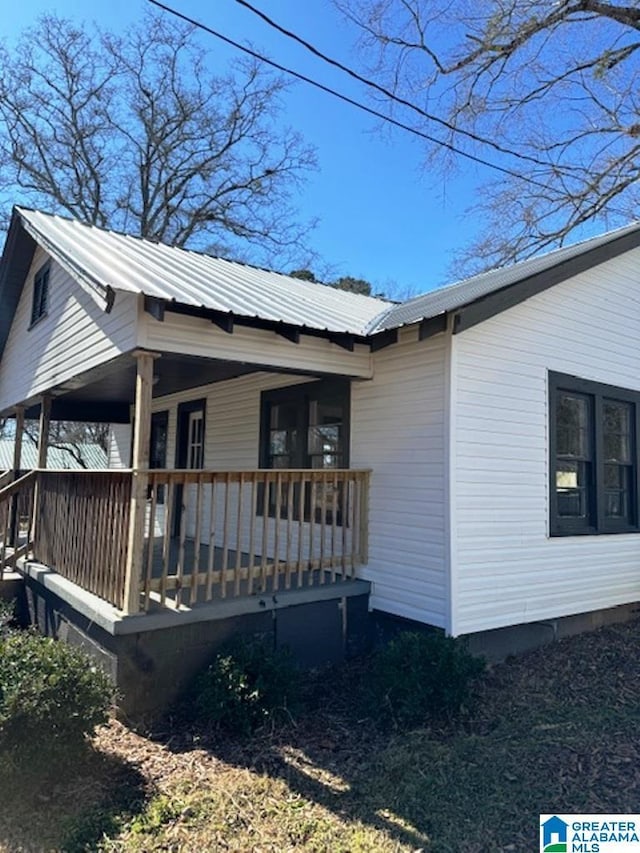 view of side of property featuring a porch