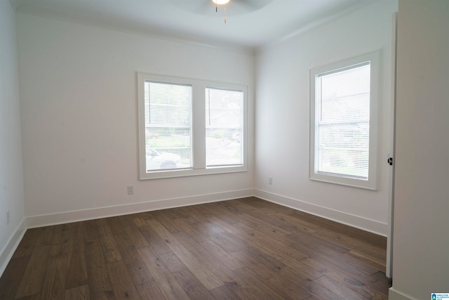 unfurnished room featuring ceiling fan and dark hardwood / wood-style flooring