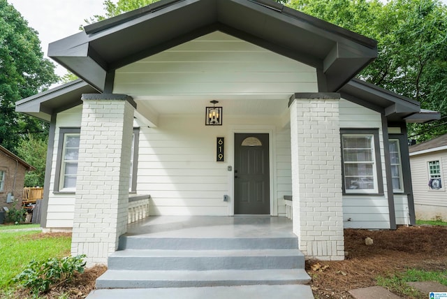 entrance to property featuring covered porch