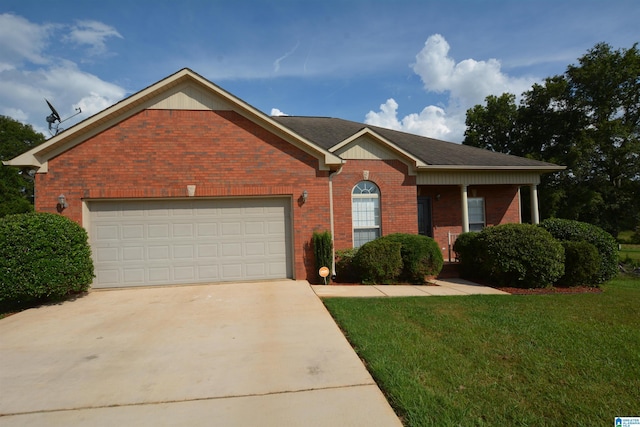 ranch-style house featuring a garage and a front lawn