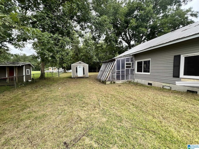 view of yard with a storage unit