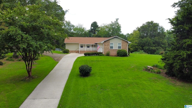 ranch-style house with a front lawn