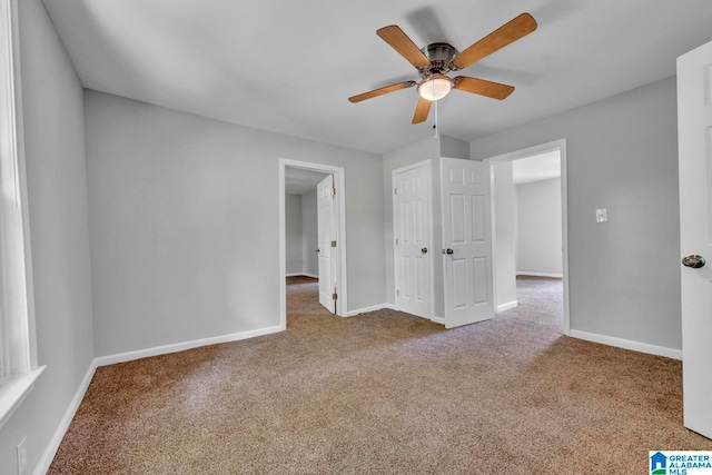 interior space with ceiling fan