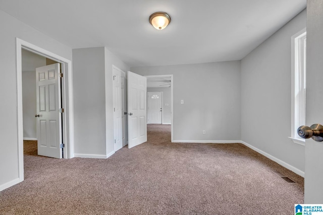 unfurnished bedroom with carpet