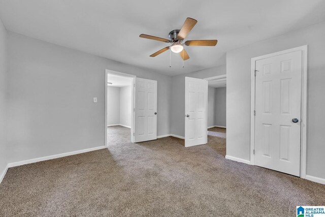 unfurnished bedroom featuring ceiling fan and carpet flooring