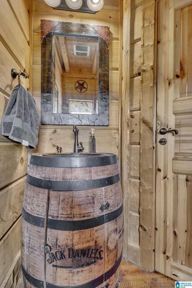 bathroom with wood walls