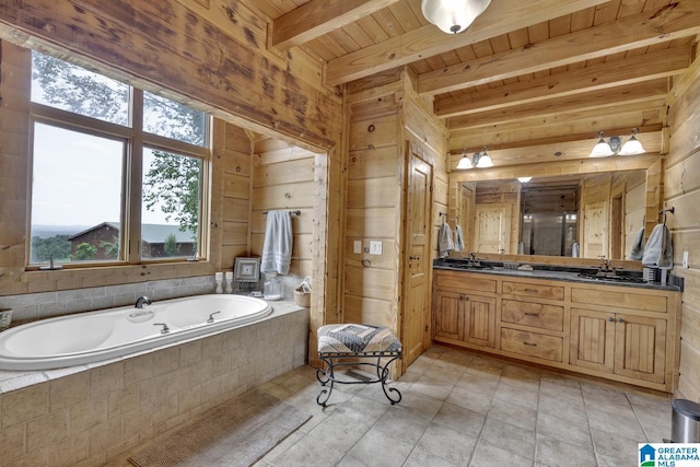 bathroom featuring tile patterned floors, wood ceiling, vanity, a relaxing tiled tub, and beam ceiling