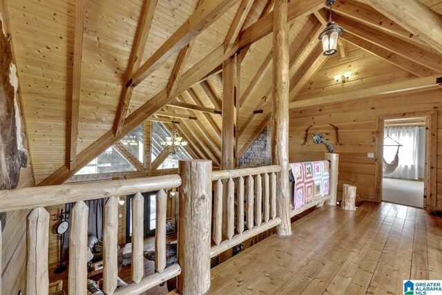 interior space featuring wood ceiling, beam ceiling, high vaulted ceiling, wood-type flooring, and wood walls