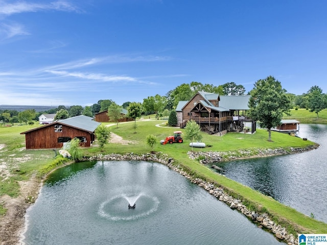 exterior space featuring a yard and a water view