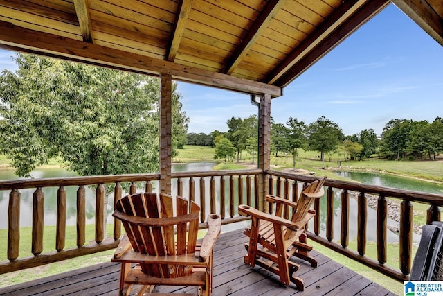 wooden deck with a water view