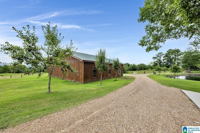 exterior space with a yard and a water view