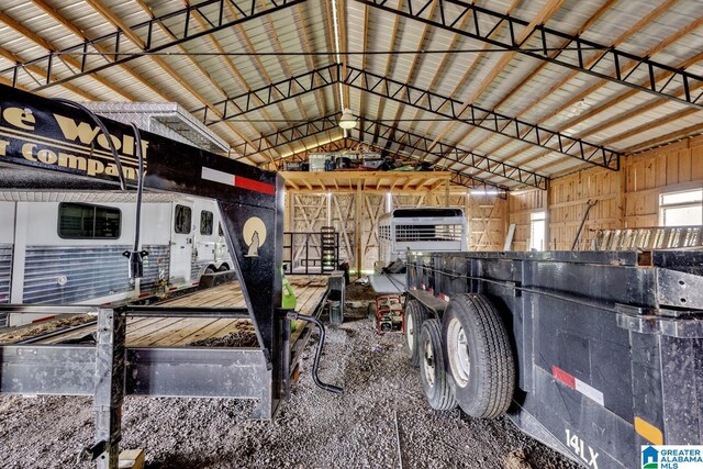 misc room featuring lofted ceiling with beams