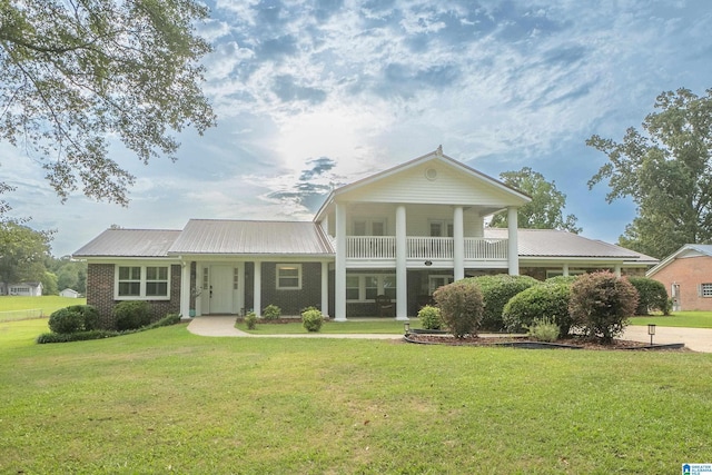 neoclassical / greek revival house with a front yard