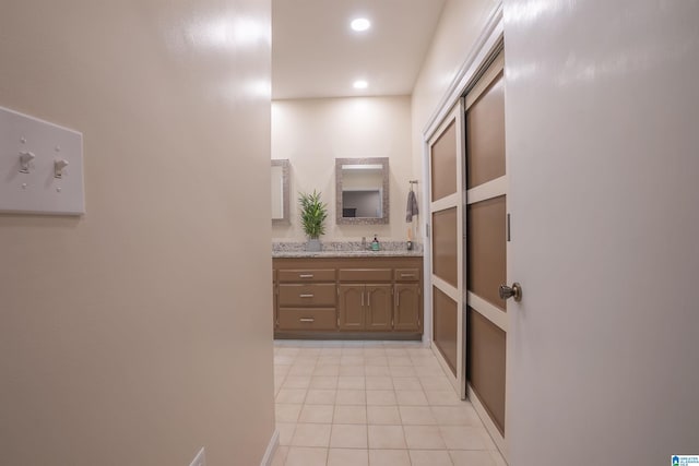 bathroom with vanity and tile patterned flooring