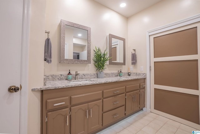 bathroom with vanity and tile patterned floors