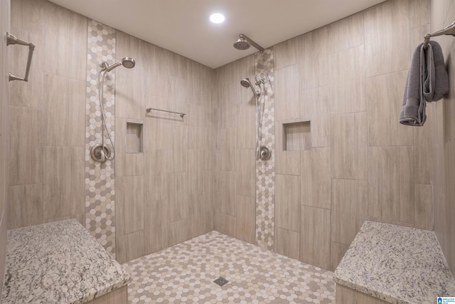 bathroom with tiled shower