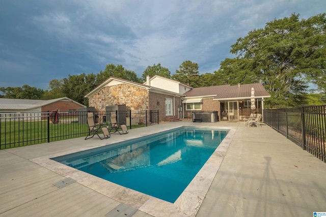 view of swimming pool with a patio