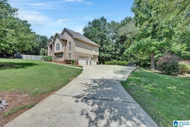 view of front of property featuring a front lawn and a garage