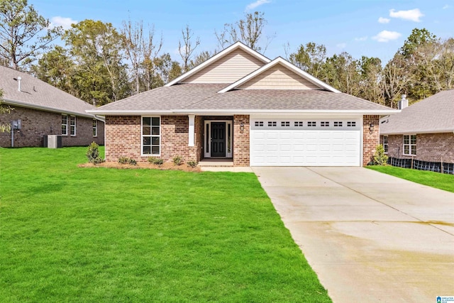 view of front of house featuring cooling unit, a garage, and a front yard