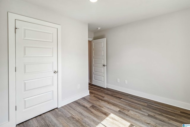 unfurnished bedroom featuring wood-type flooring