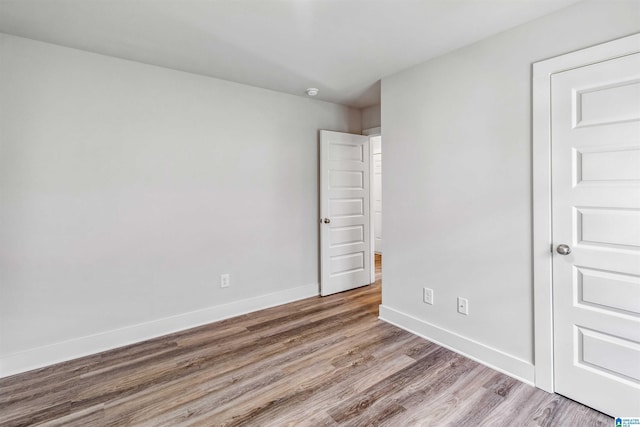 unfurnished room with light hardwood / wood-style flooring