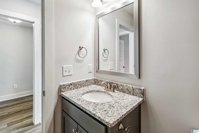 bathroom featuring vanity and wood-type flooring