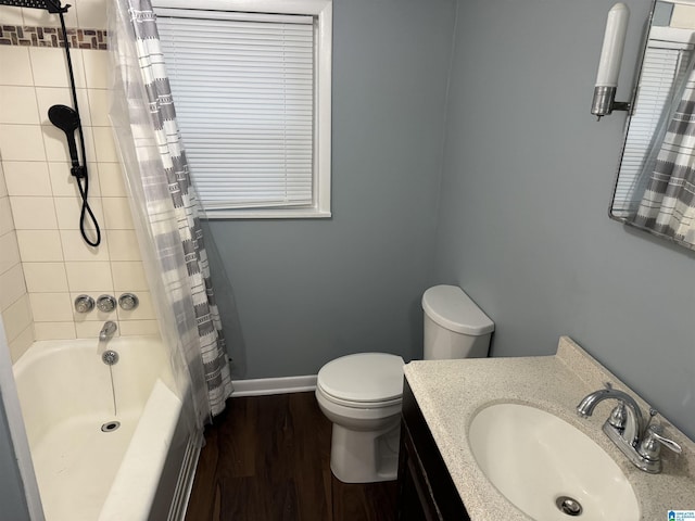 full bathroom with shower / tub combo, vanity, hardwood / wood-style flooring, and toilet