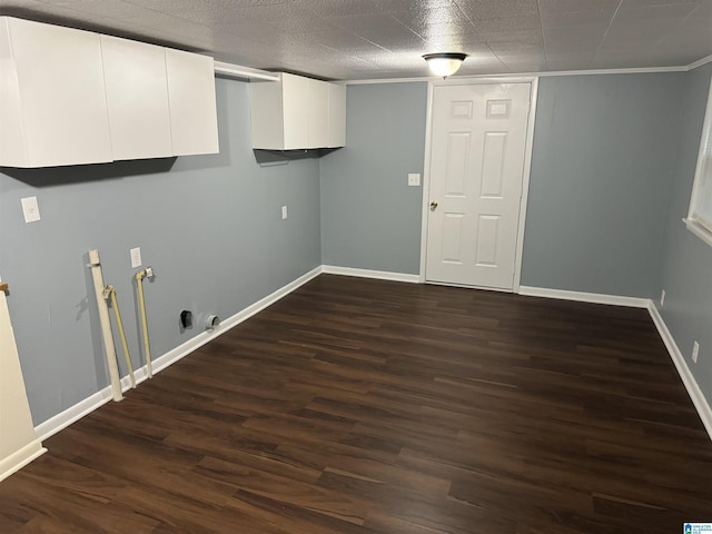 laundry room with cabinets and dark hardwood / wood-style floors