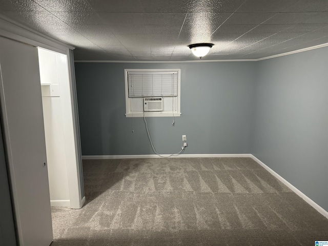 carpeted spare room featuring cooling unit and ornamental molding