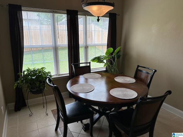 dining space with light tile patterned floors