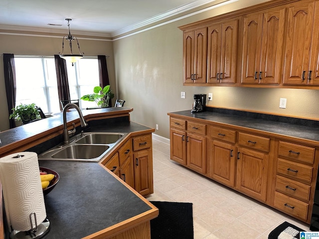 kitchen featuring sink, light tile patterned floors, ornamental molding, and hanging light fixtures