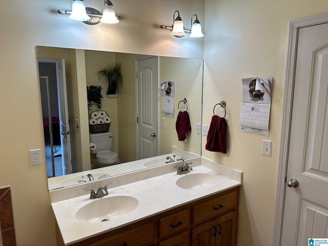 bathroom with vanity and toilet