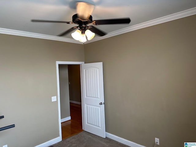 unfurnished room featuring crown molding, ceiling fan, and carpet flooring