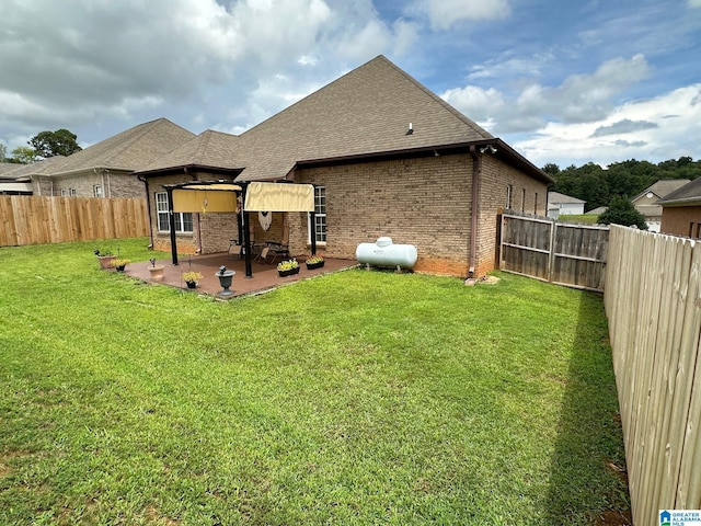 back of property featuring a patio area and a lawn